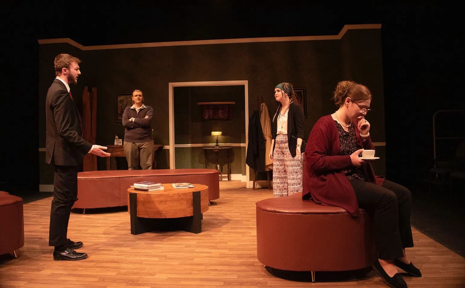 Wide view of the living-room set with four actors