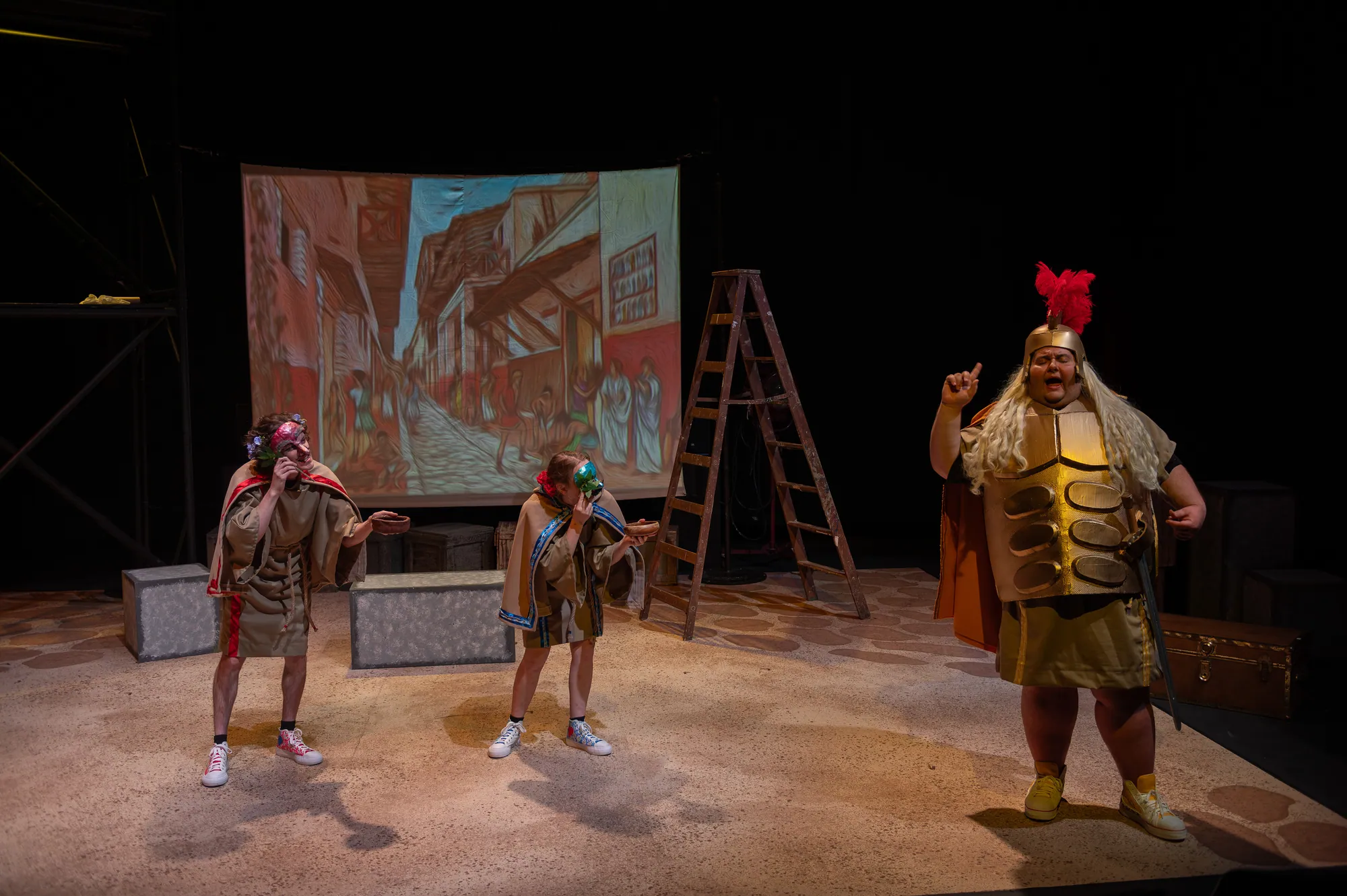 Ensemble with a Roman soldier in a red-plumed helmet before a painted street