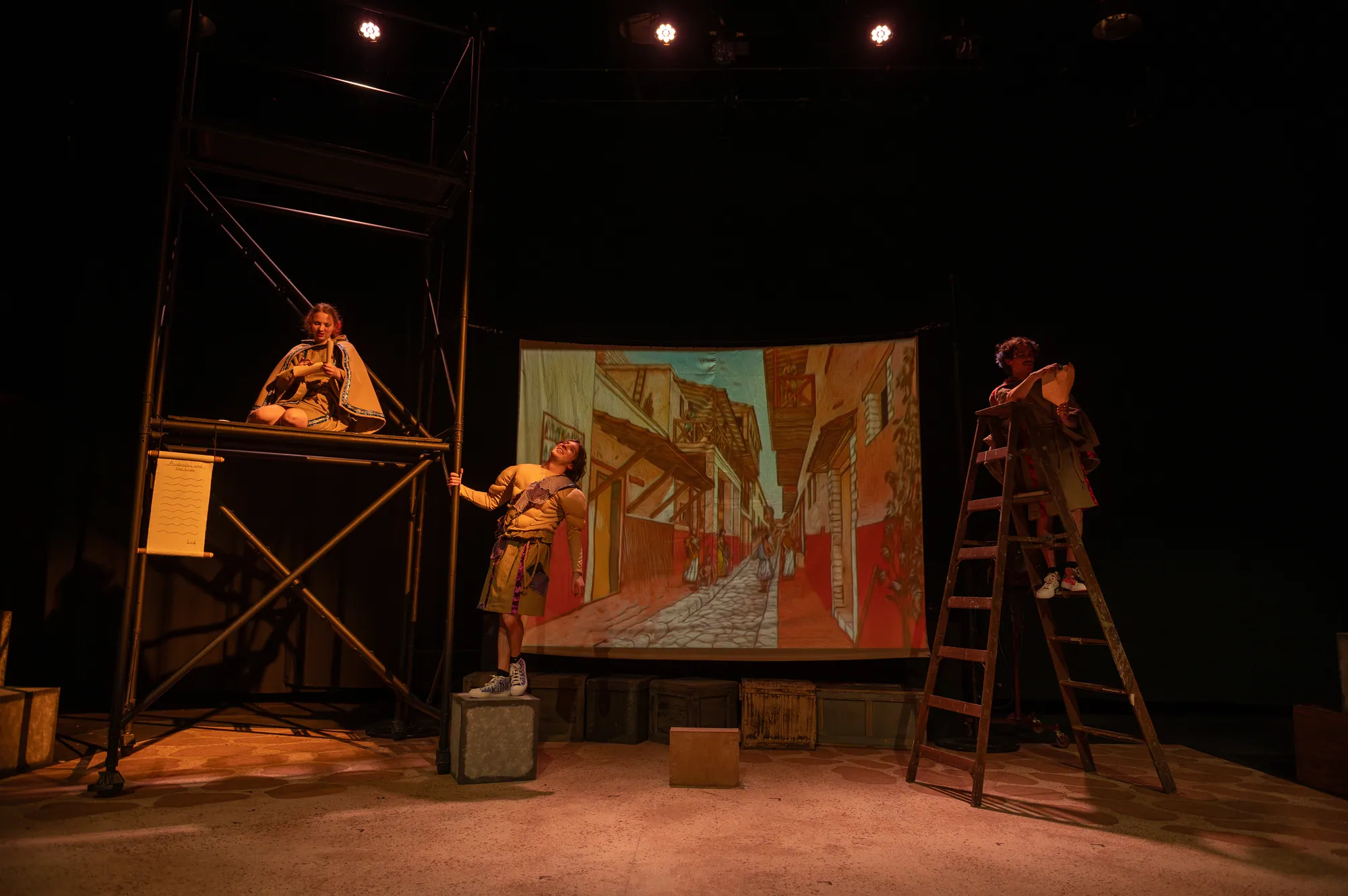 Wide view of the scaffolding set with actors on ladders